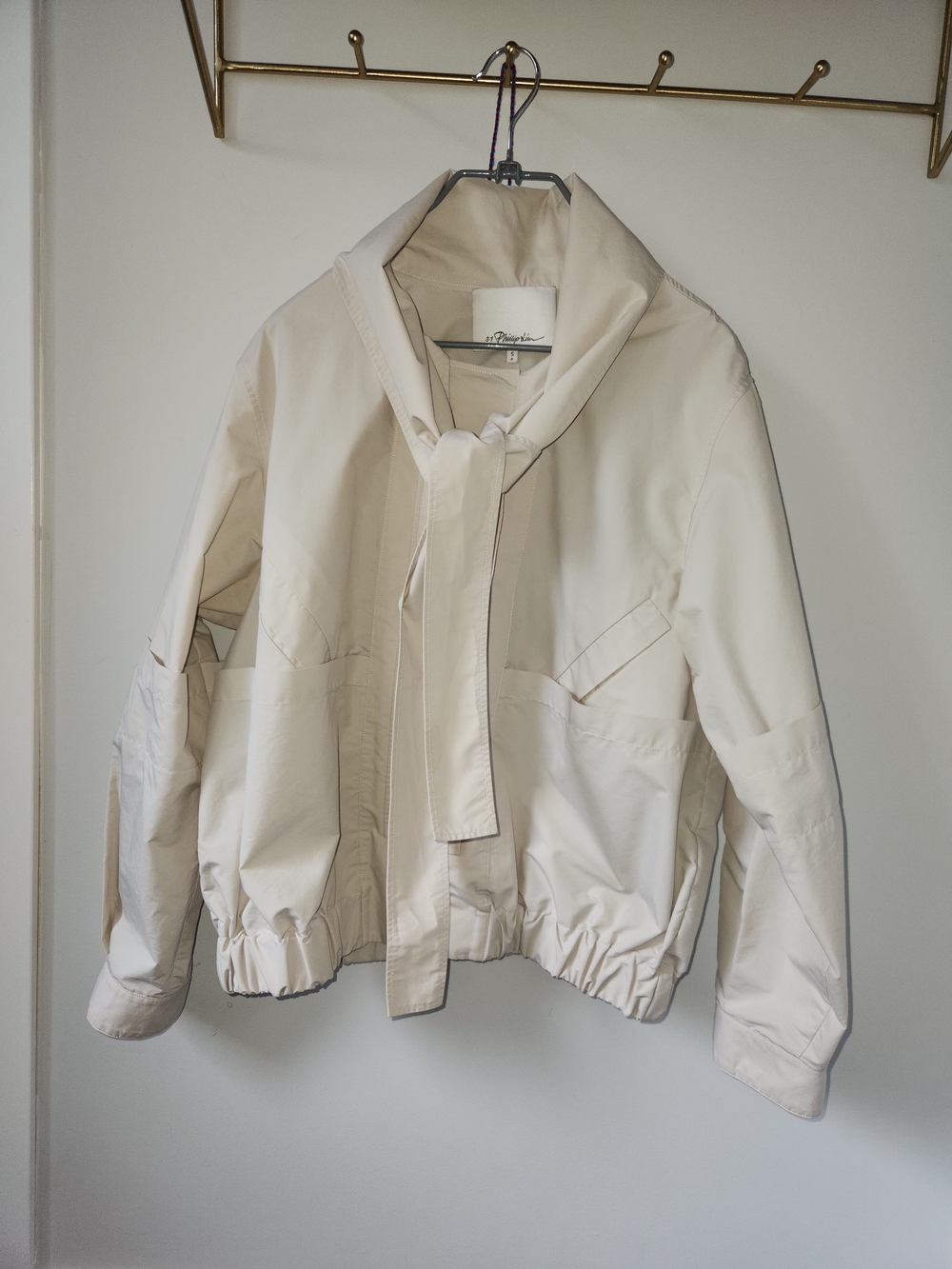 Women’s Cream Bomber Jacket with Neck Tie